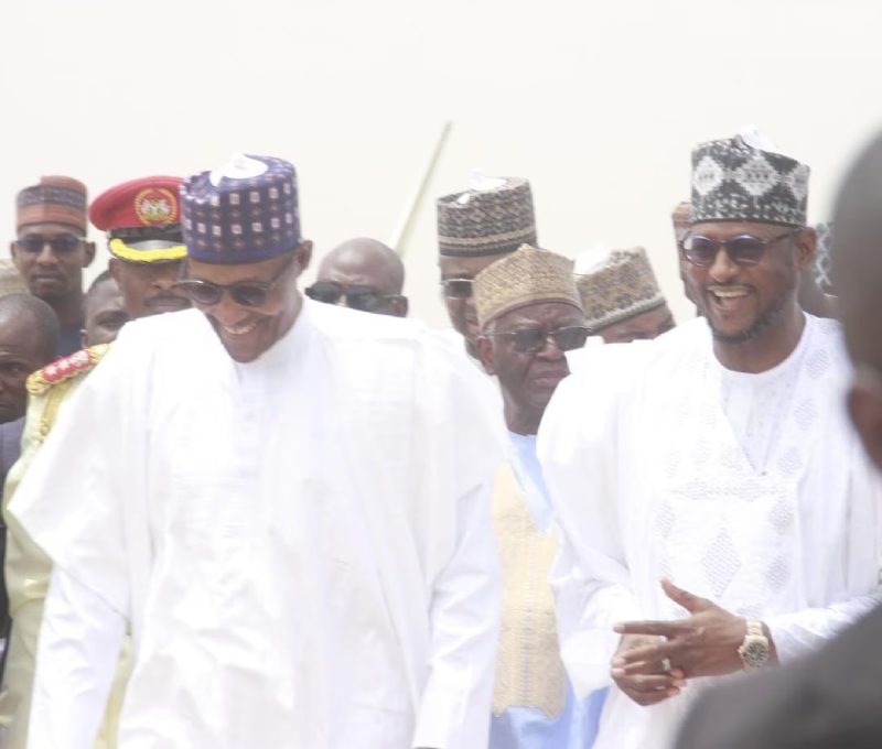 Buhari being received on his arrival in Katsina by the new Katsina State governor, Alhaji Dikko Radda, after handover in Abuja.