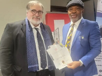 *  Dr Nikolas Fokianos, President, International Security Organization (Left) and Dr Peter Afunnanya, DSS Spokesman (Right) receiving the award on behalf of his boss, Alhaji Yusuf Bichi. 