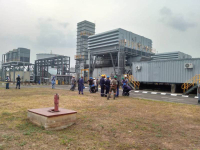 Geometric Power Engineers rejoicing at the company's premesis on Sunday as the turbines were turned on.