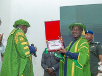 Vice Chancellor of UNN, Prof Charles Arizechukwu Igwe (left), presenting a plaque to Gov Otti after the Governor delivered his lecture on Thursday.