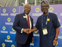 *  Lion Horatious Egua, Publisher of The Bridge Online Newspaper (R) and Lion Douglas X. Alexander (L) during the decoration event.