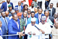*  Brig-Gen. Muhammed Buba Marwa, Chairman/CEO  of National Drug Law Enforcement Agency, NDLEA (middle) cutting the tape during the Commissioning and (right, on Navy Suit) is Dr. Ubon Udoh, MD/CEO of Abdul Samad Rabiu Initiative (ASR Africa) holding the tape for Marwa.