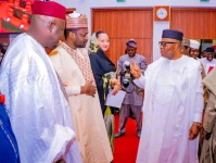 Senate President, Godswill Akpabio (right) acknowledging greetings from fellow Senators before PLENARY session on Tuesday.